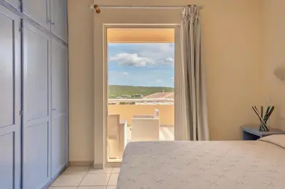 Letto o letti in una camera di Residence Baia de Bahas Golfo di Marinella