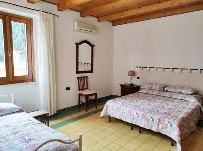 Letto o letti in una camera di Casa Lupino