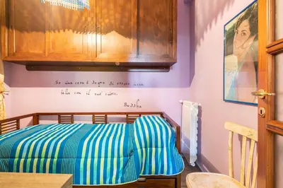 Letto o letti in una camera di Piccolo e intimo centro città