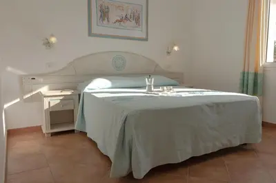Letto o letti in una camera di Le Residenze Del Golfo Di Orosei Bilo 5 - Happy Rentals