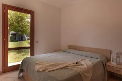 Letto o letti in una camera di Le Dimore di Budoni Apartments