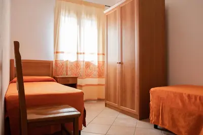 Letto o letti in una camera di Residence Cala Viola