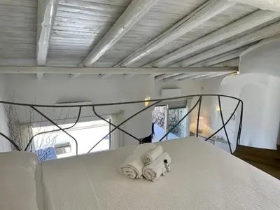 Letto o letti in una camera di SAN TEODORO PUNTA EST FANTASTICO TRILOCALE VISTA MARE