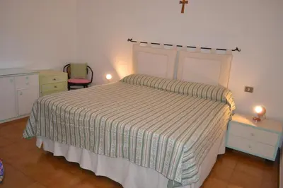 Letto o letti in una camera di Appartamento con patio