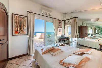Letto o letti in una camera di Holiday home in Cala Gonone Nuoro Provinz 40363