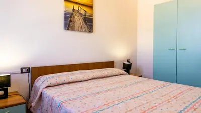 Letto o letti in una camera di Appartamento sette posti vicino al centro di San Teodoro