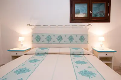 Letto o letti in una camera di Villa Dalia Punta Molara San Teodoro