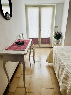 Letto o letti in una camera di Cala Gonone Holiday Flats