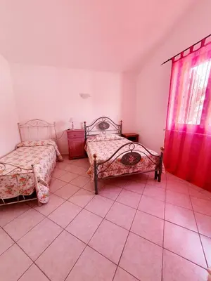 Letto o letti in una camera di Casa vacanze Nietta