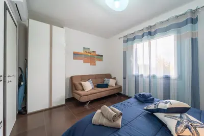 Letto o letti in una camera di Appartamento moderno a 500 MT dalle sabbie bianche