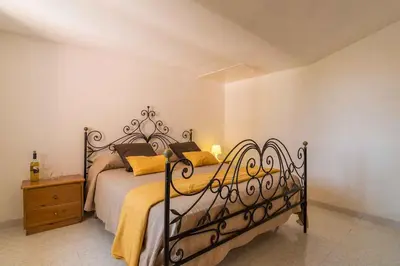 Letto o letti in una camera di Holiday home in Cala Gonone Nuoro Provinz 43626