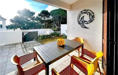 Area soggiorno di Lovely Home In Baia S Anna Budoni