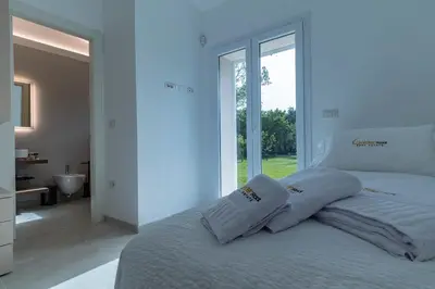 Letto o letti in una camera di Golden Root San Teodoro