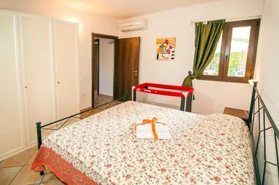 Letto o letti in una camera di residence lu soli budoni affitti