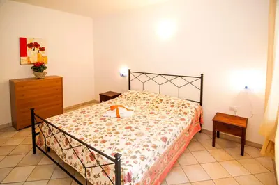 Letto o letti in una camera di residence lu soli budoni affitti