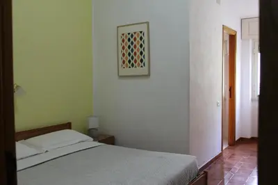 Letto o letti in una camera di Piccolo Hotel Nuova gestione