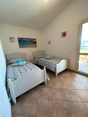 Letto o letti in una camera di Casa Boi Dessena 1