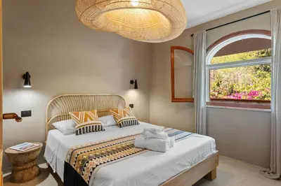 Letto o letti in una camera di Baia Dorata beach apartments