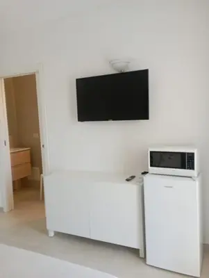 TV o dispositivi per l'intrattenimento presso Sea & Country Rooms Porto Rotondo Golfo Aranci