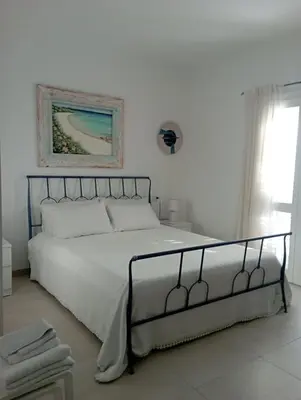 Letto o letti in una camera di Sea & Country Rooms Porto Rotondo Golfo Aranci