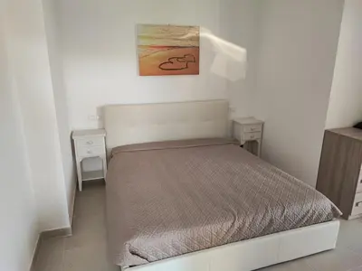 Letto o letti in una camera di Villetta Baia 1