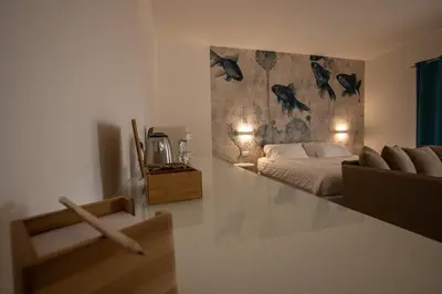 Letto o letti in una camera di Il Borgo Boutique Rooms by KasaVacanze