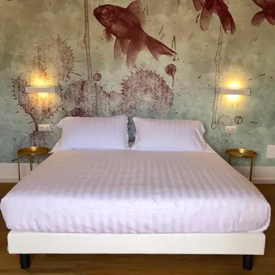 Letto o letti in una camera di Il Borgo Boutique Rooms by KasaVacanze