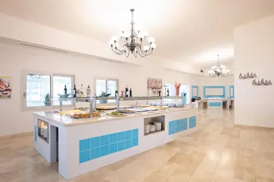 Cucina o angolo cottura di Nicolaus Club Quattro Lune Resort