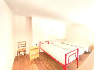 Letto o letti in una camera di Casa Trentino 2