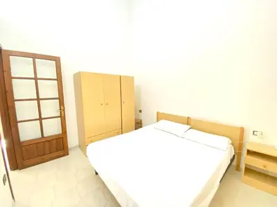 Letto o letti in una camera di Casa Trentino 2
