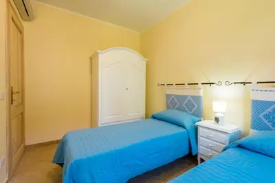 Letto o letti in una camera di Le Perle Di Golfo Aranci