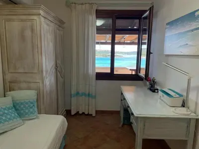 Letto o letti in una camera di Sandy Cove Patio Villa sul Mare