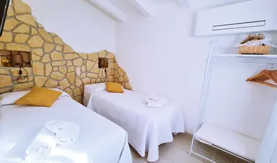 Letto o letti in una camera di Lo Stazzo della Dottoressa
