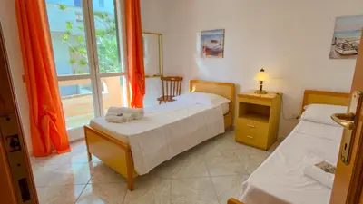 Letto o letti in una camera di Appartamento l'Ulivo