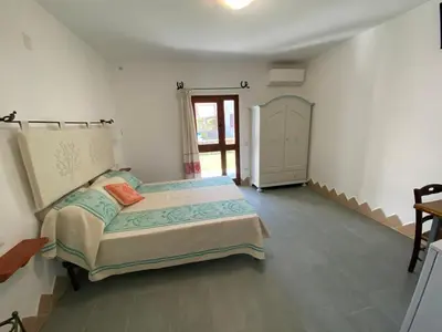 Letto o letti in una camera di Sa Domo De Rosa