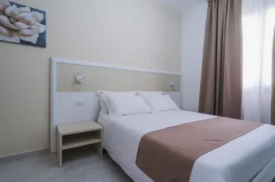 Letto o letti in una camera di VeMi Affittacamere