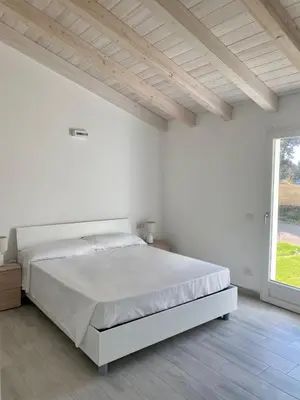 Letto o letti in una camera di Villetta 4 La Caletta