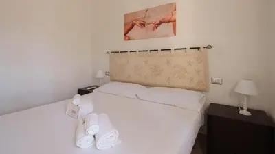 Letto o letti in una camera di MareSole La Cinta