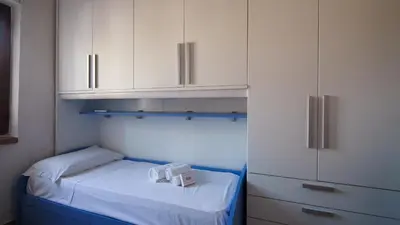 Letto o letti in una camera di MareSole La Cinta