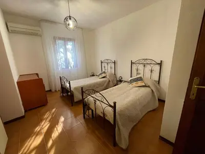 Letto o letti in una camera di Villa Mariaurelia