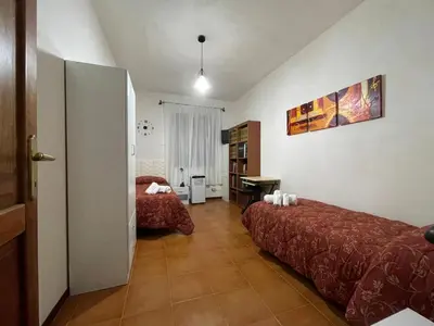 Letto o letti in una camera di Villa Mariaurelia