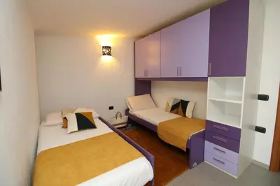 Letto o letti in una camera di Corona's Apartment- Fronte Spiaggia