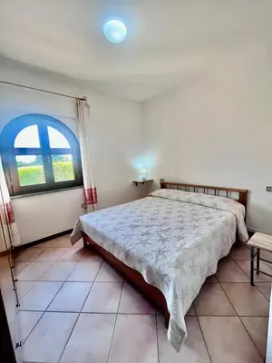 Letto o letti in una camera di Villetta Anna