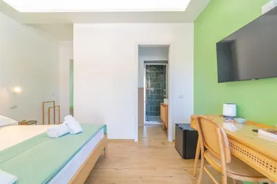Letto o letti in una camera di Mensos Rooms