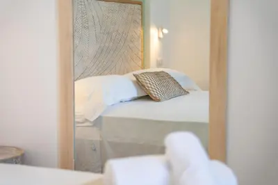 Letto o letti in una camera di Mensos Rooms