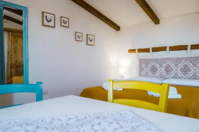 Letto o letti in una camera di Panoramic Loft con uso cucina ,Casa Raimonda, Ammentos Posada