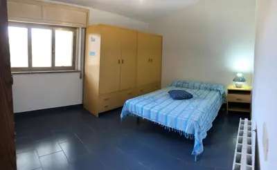 Letto o letti in una camera di Casa Linda