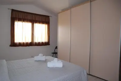Letto o letti in una camera di Appartamento La Paduledda