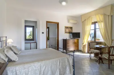 Letto o letti in una camera di Villa La Maison D'Anna Maria - LT - PMS CaseVacanze