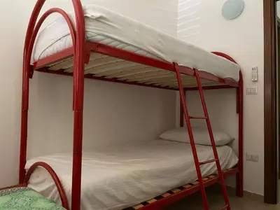 Letto o letti in una camera di FAN SARD Villetta 10 posti letto FBU-ZAN01